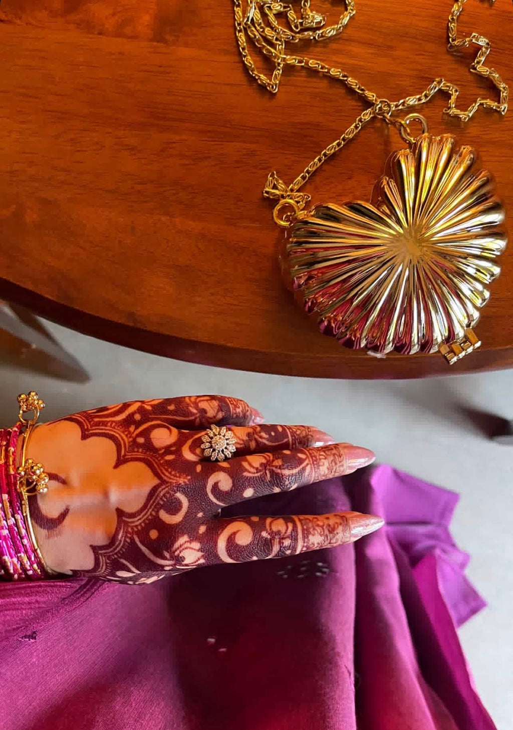 Golden metalic heart clutch